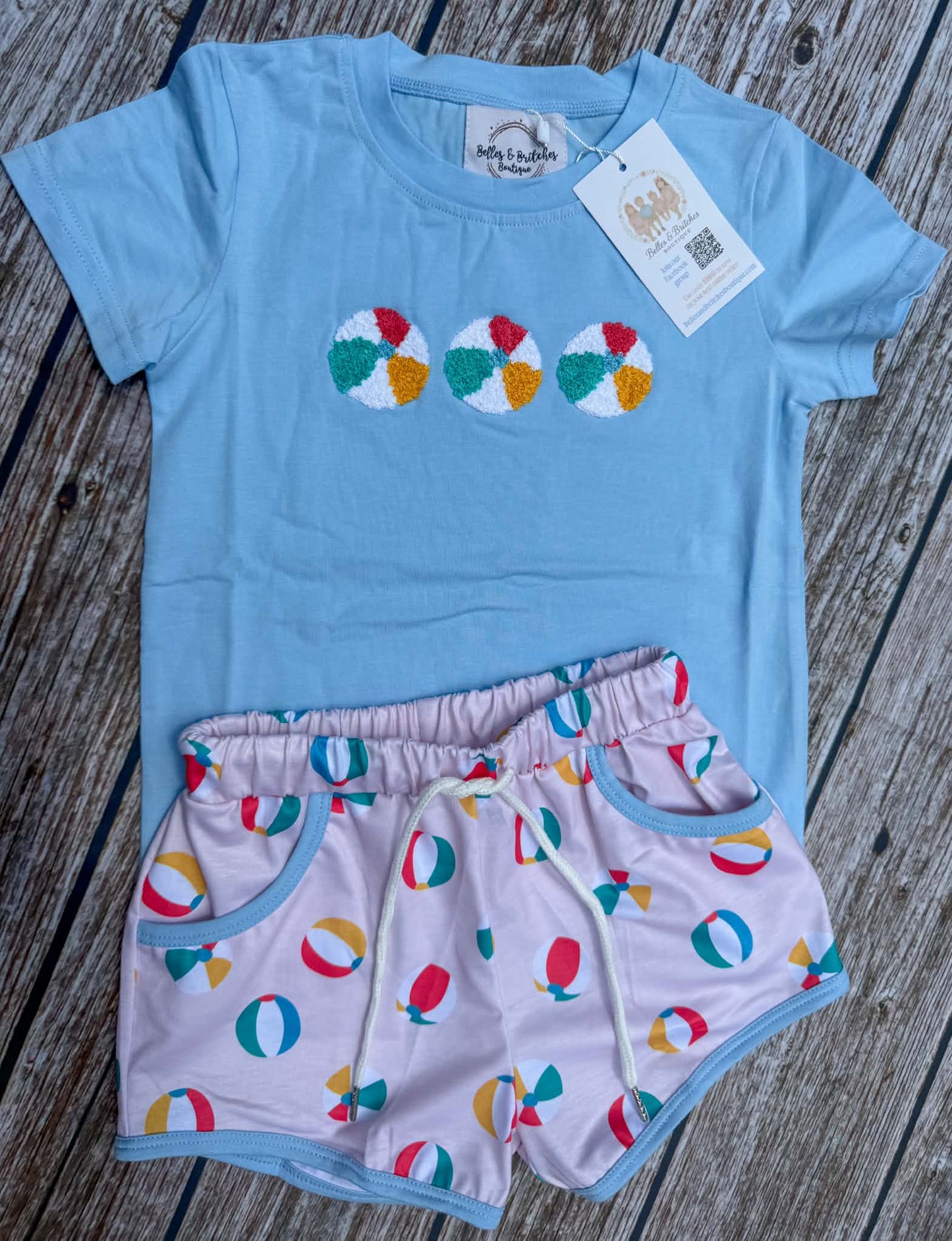 Boys blue shirt with French knot beach ball embroidery and colorful beach ball print shorts 