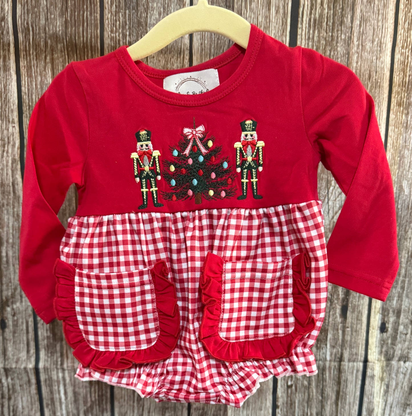 Girls red and white gingham Christmas bubble with embroidered nutcrackers and Christmas tree