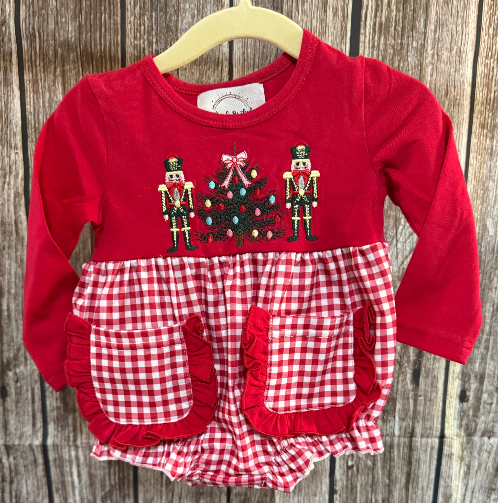 Girls red and white gingham Christmas bubble with embroidered nutcrackers and Christmas tree