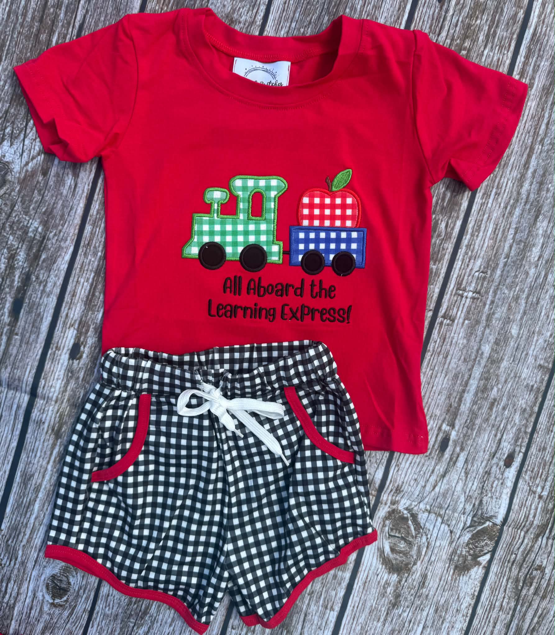 Boys red back to school short set with train and apple appliqué and black gingham shorts