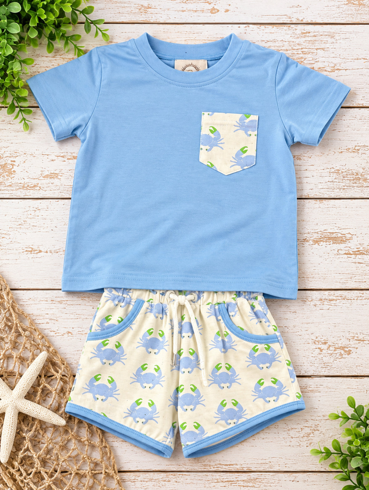 Boys light blue pocket shirt with cream blue crab print shorts and coordinating blue trim