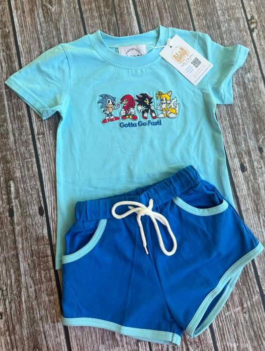 Gotta Go Fast boys short set with aqua embroidered short sleeve shirt and royal blue drawstring shorts with pockets and aqua trim.