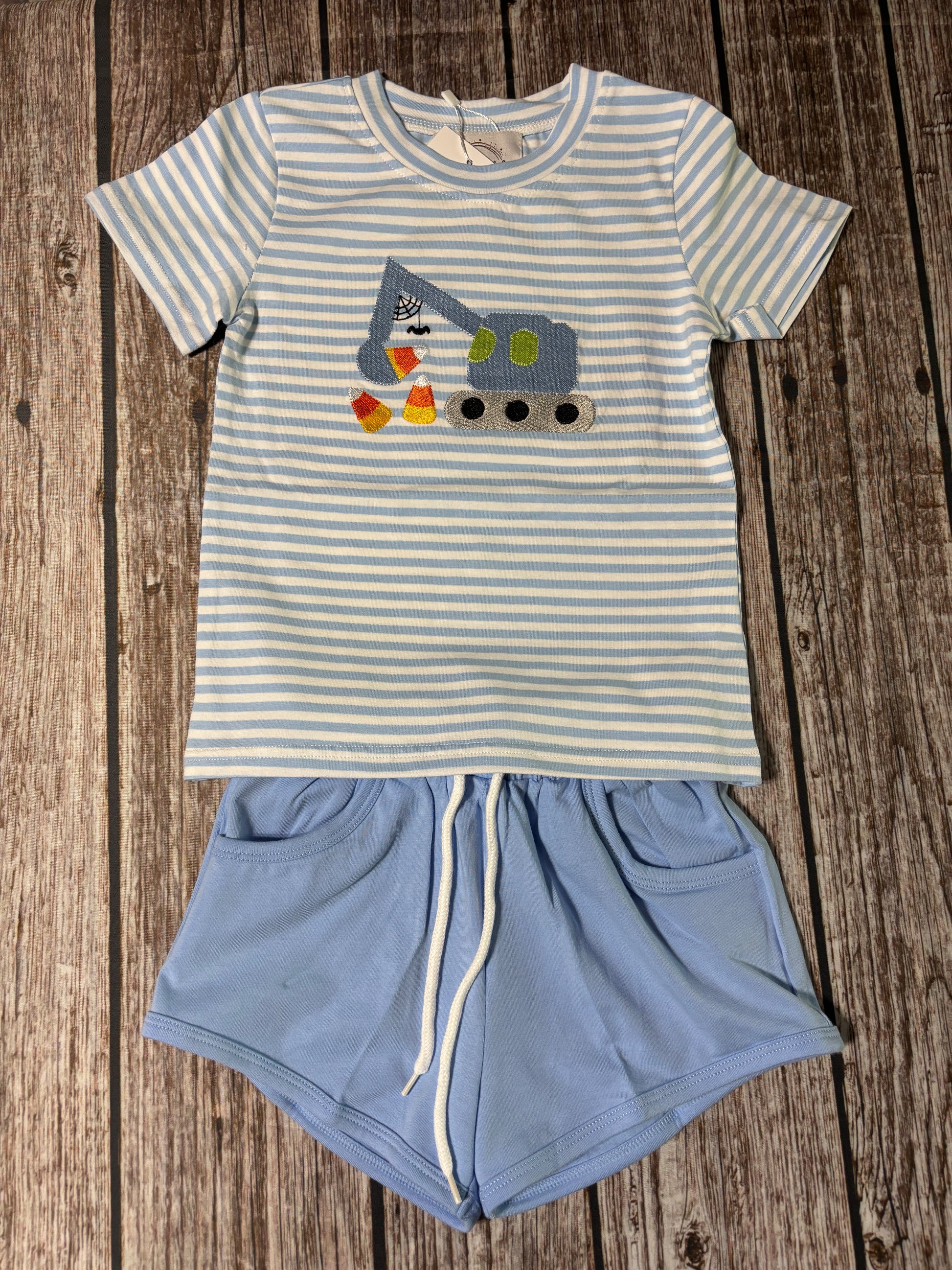 Harvest Haulers boys blue striped short set with embroidered construction vehicle and candy corn and solid light blue shorts.