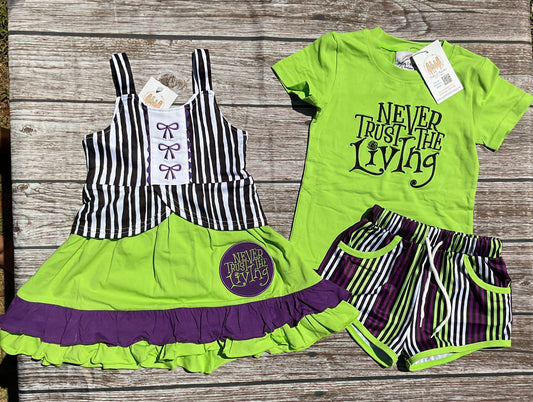 It’s Showtime Halloween sibling collection with green and purple girls ruffle dress and coordinating boys short set