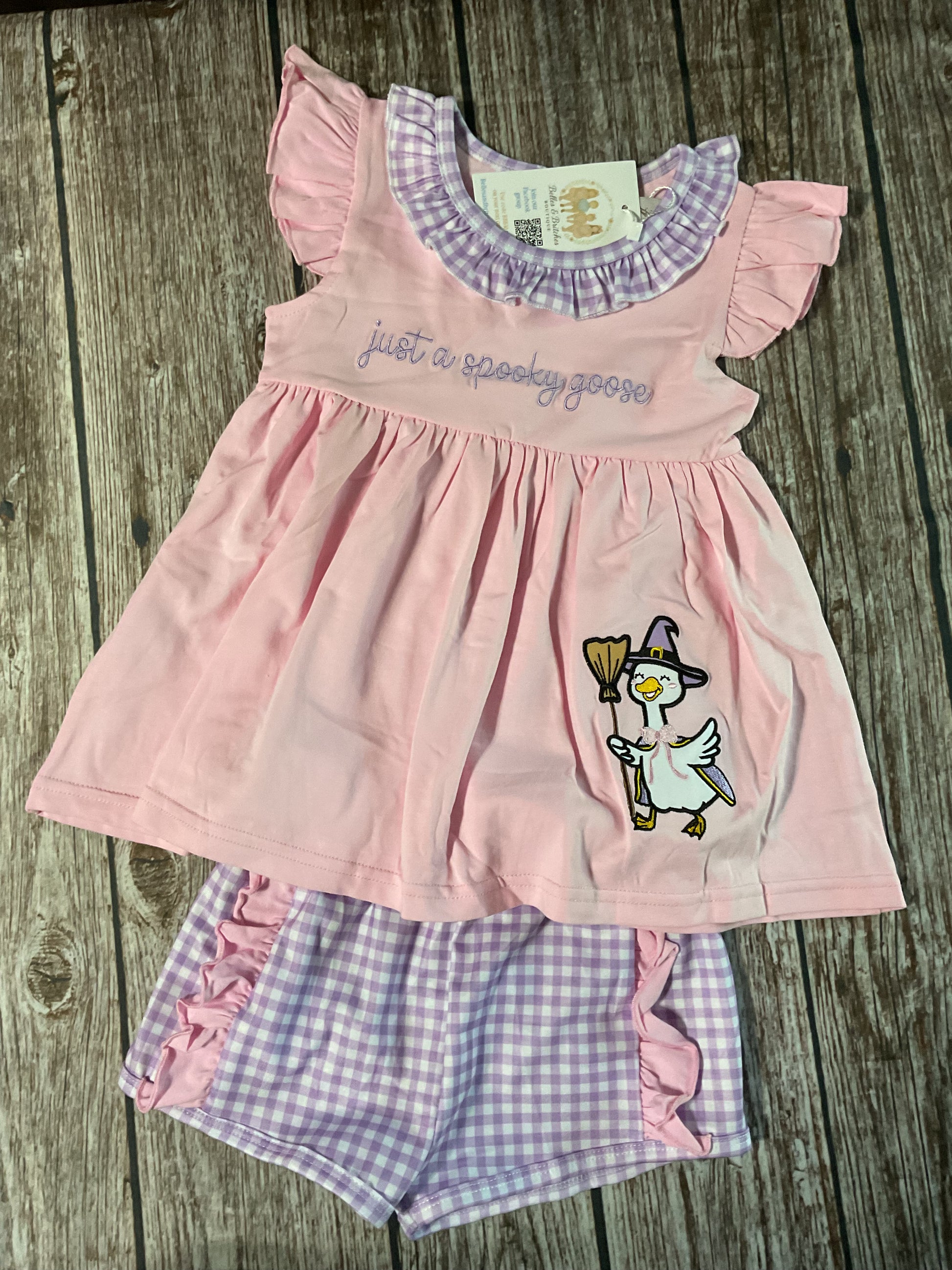 Just A Spooky Goose girls Halloween short set with pink embroidered goose top and lavender gingham shorts with pink ruffle accents.