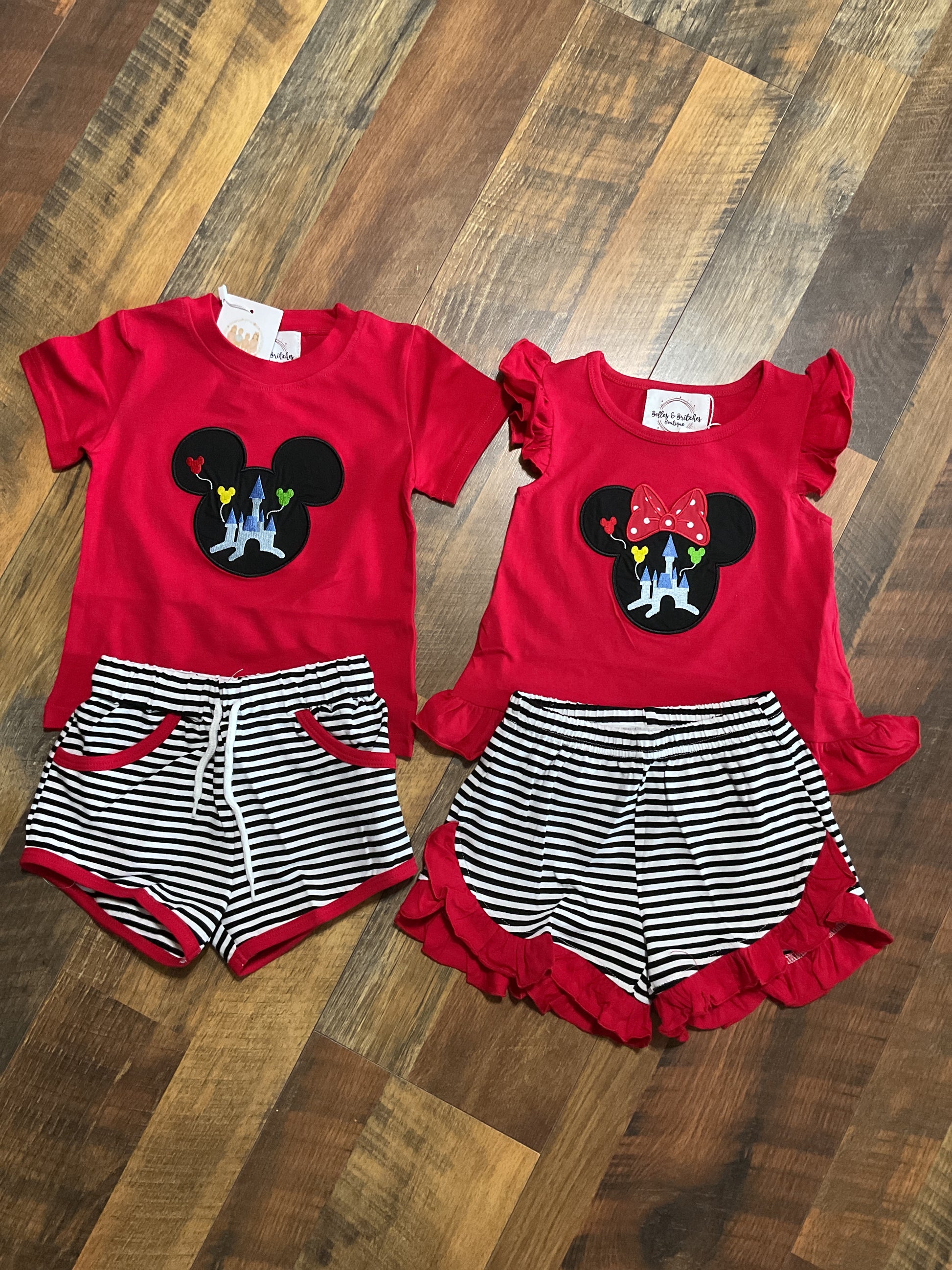 Magic Within sibling matching girl and boy short sets with red tops, castle appliqués and black and white striped shorts