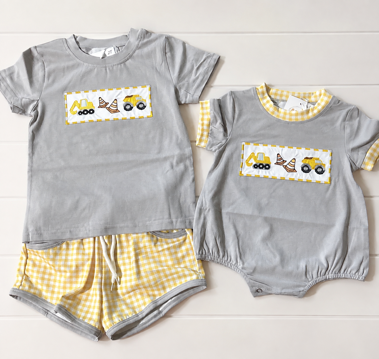 Mighty I Am boys construction bubble and short set with embroidered trucks and yellow gingham details