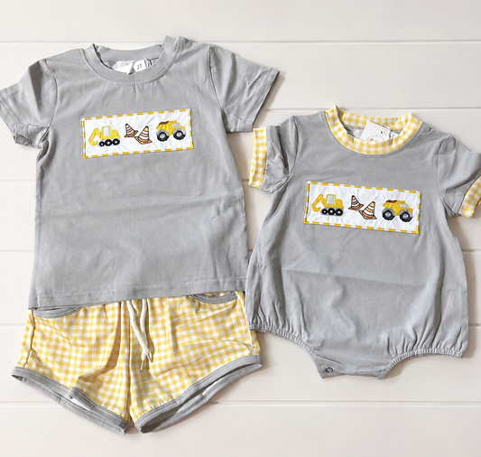 Mighty I Am boys construction bubble and short set with embroidered trucks and yellow gingham details