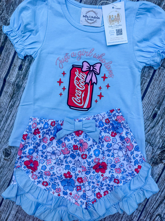 Girls blue embroidered soda shop top with colorful floral ruffle shorts and bow detail
