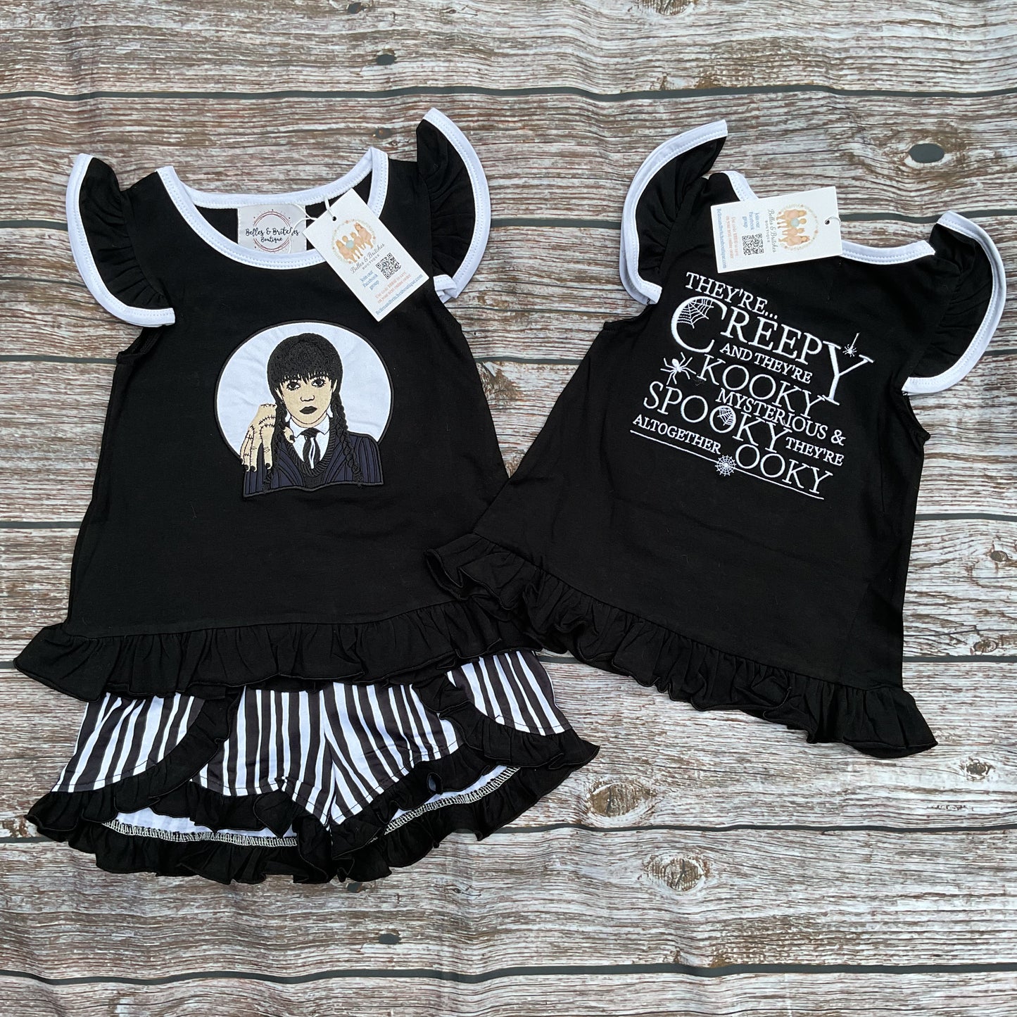 Girls black Halloween ruffle short set with spooky design and black and white striped shorts
