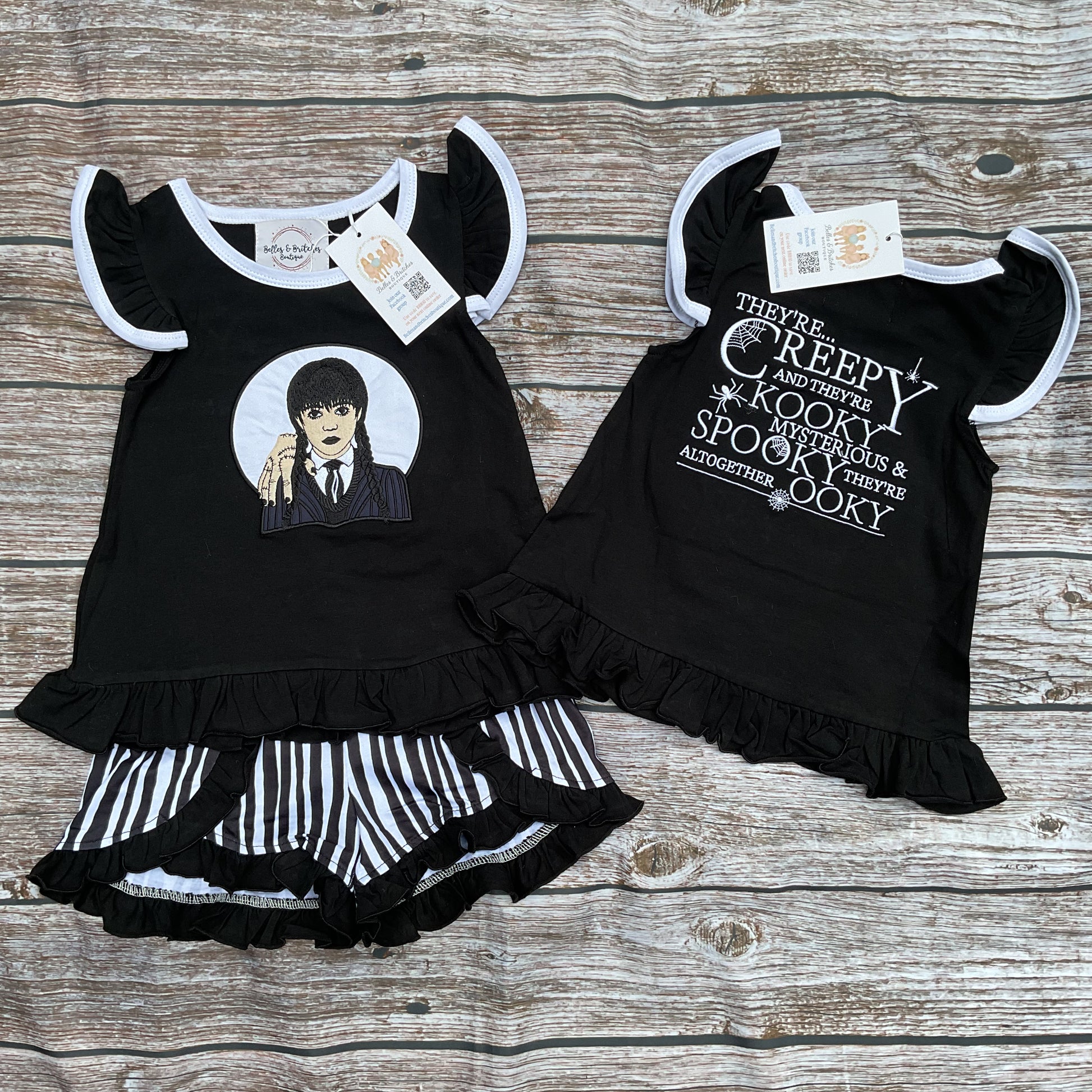 Girls black Halloween ruffle short set with spooky design and black and white striped shorts