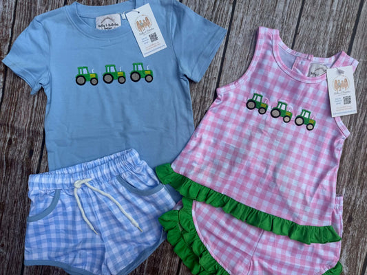 Brother and sister matching tractor short sets with blue gingham boys shorts and pink gingham girls outfit with green ruffles